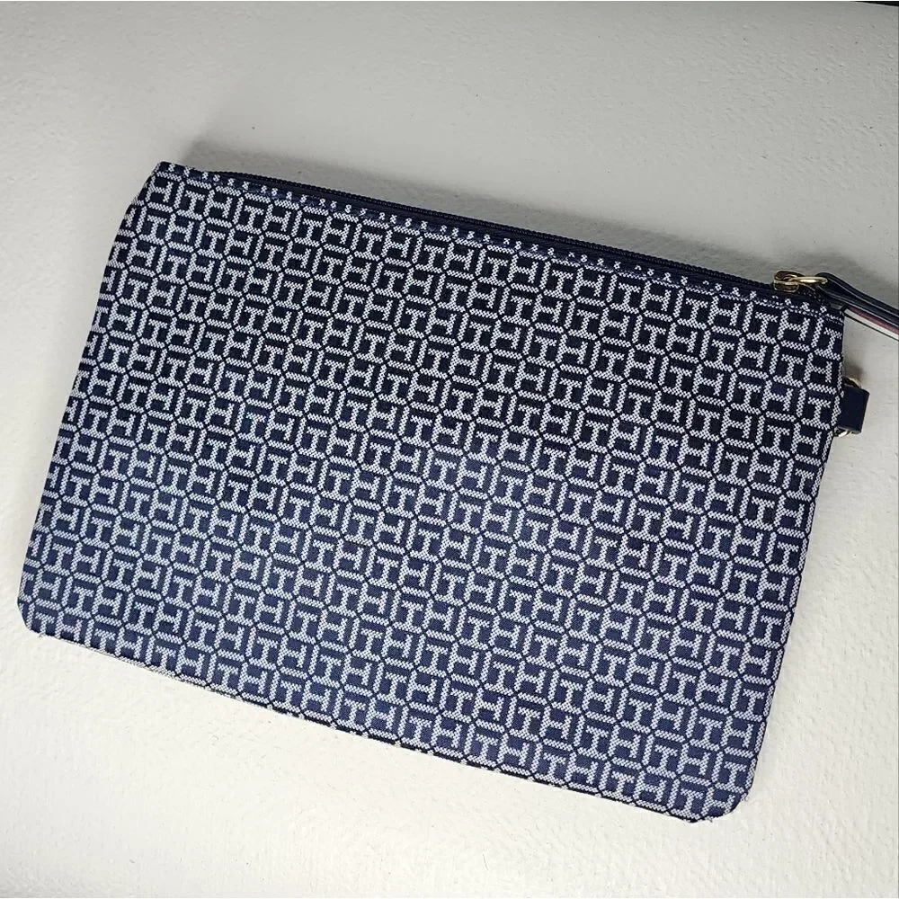 Tommy Hilfiger Wristlet Blue And White with red accents.